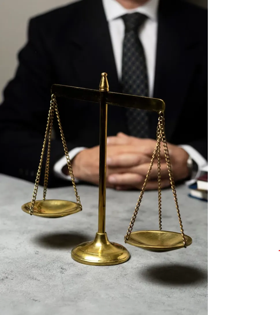 Guy in suit with a balance scale.
